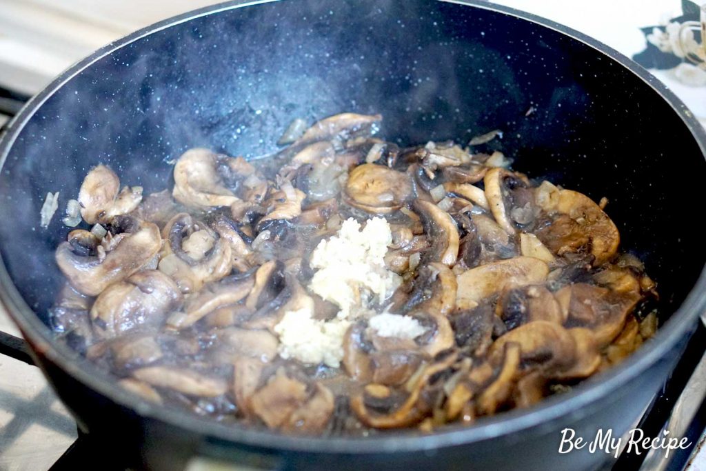 mushroom sauce - adding garlic to the pan of sauteed mushrooms and onions