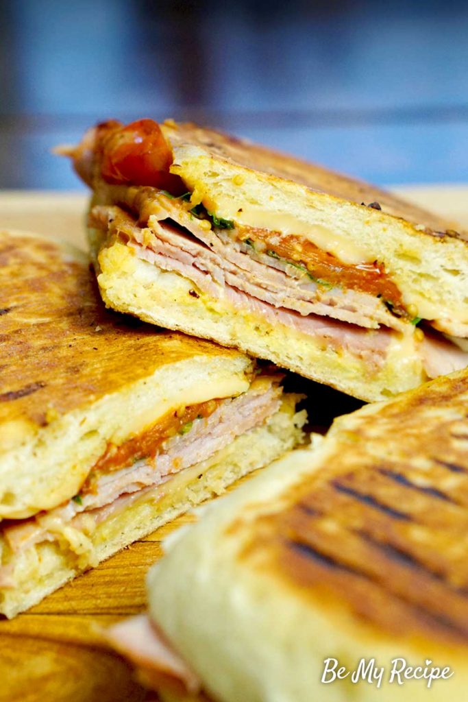 Ham and cheese panini with roasted tomatoes.