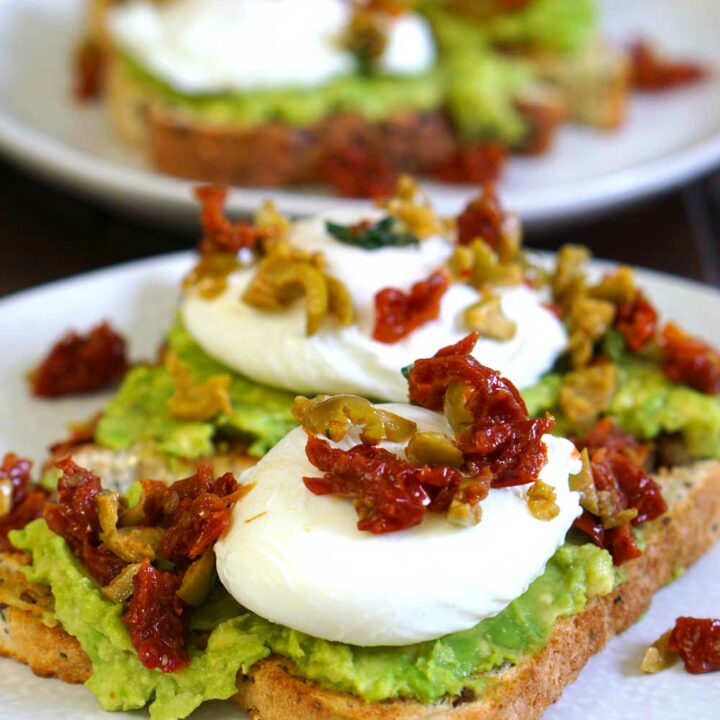 Poached Eggs with Avocado, Sun-Dried Tomatoes, Olives, and Basil