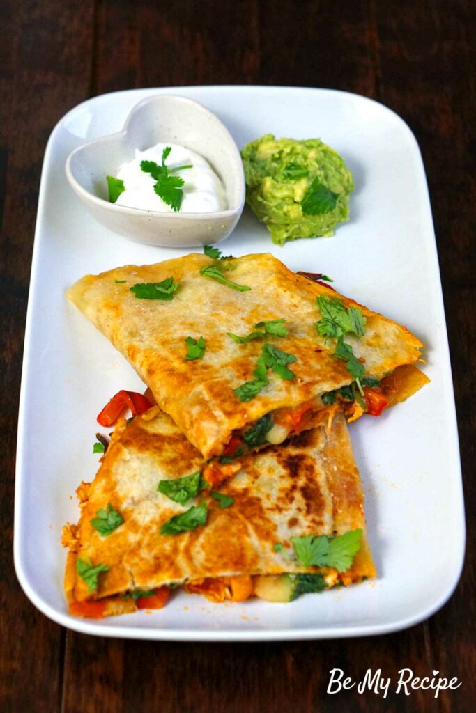 Chicken Quesadillas with mashed avocado and sour cream