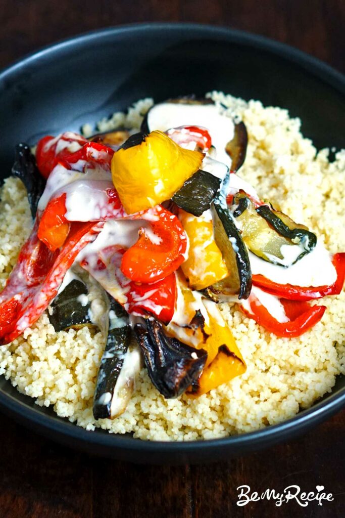 Couscous with roasted peppers, zucchini, and eggplant as well as tahini sauce