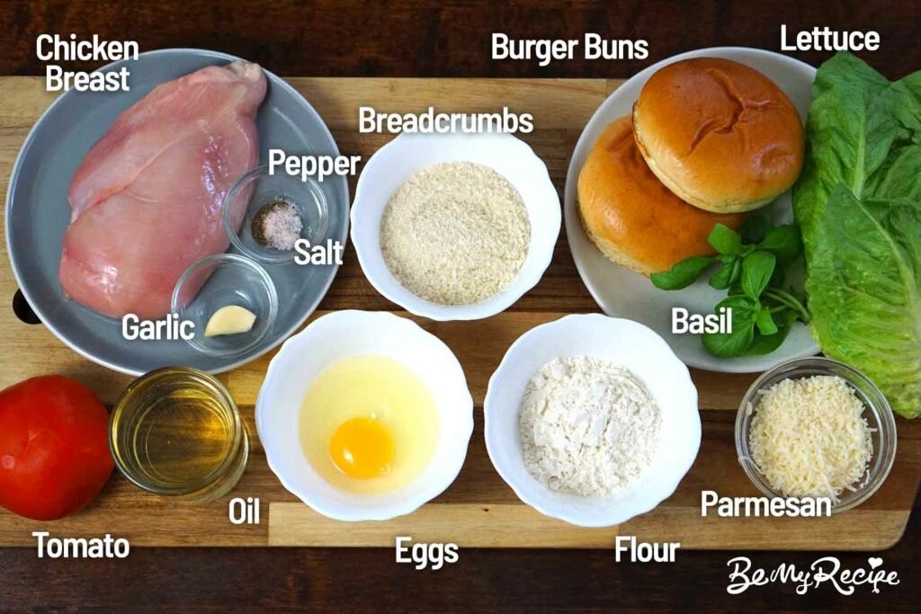 Crispy chicken burger ingredients on a board