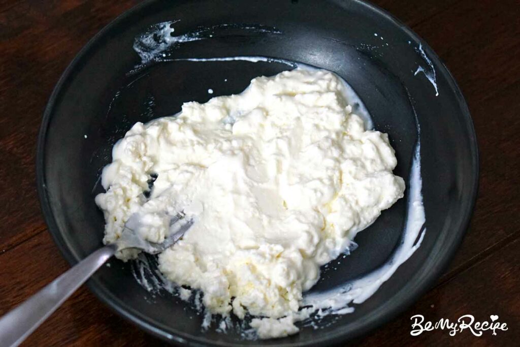 Mixing the feta cheese, lemon juice, and yogurt