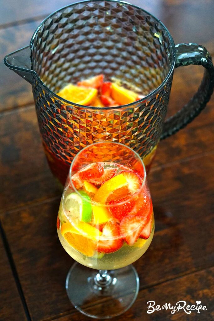 Sangria in a glass and in a pitcher.