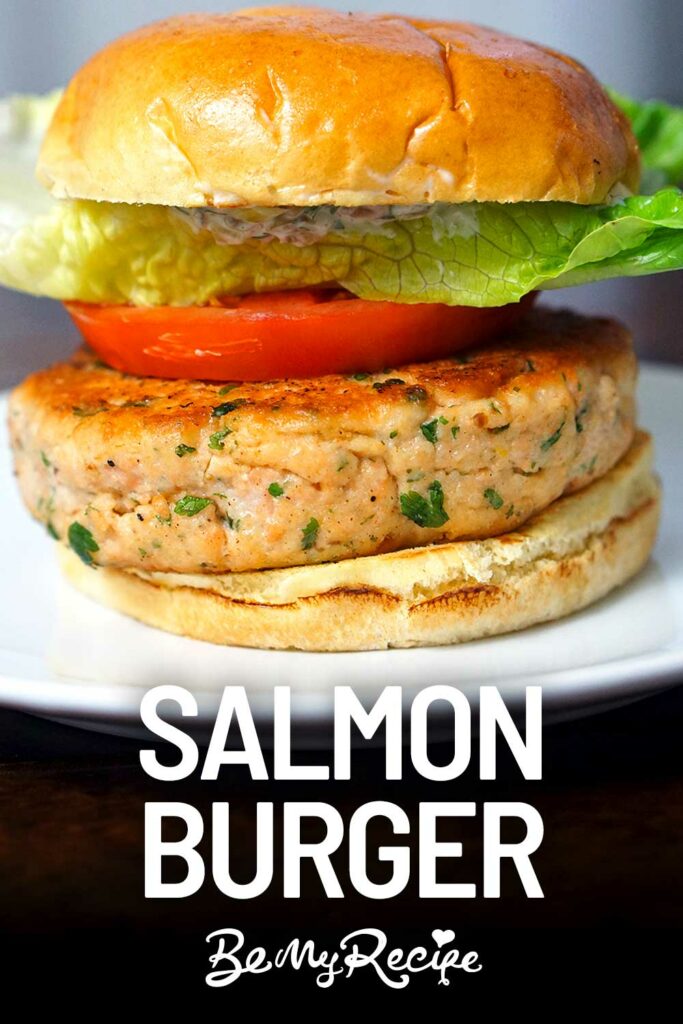 salmon burger with lettuce, tomato, and mayo sauce