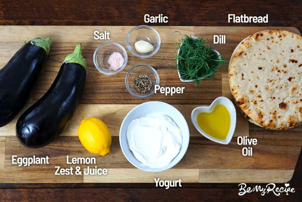 Eggplant dip ingredients on a wooden board