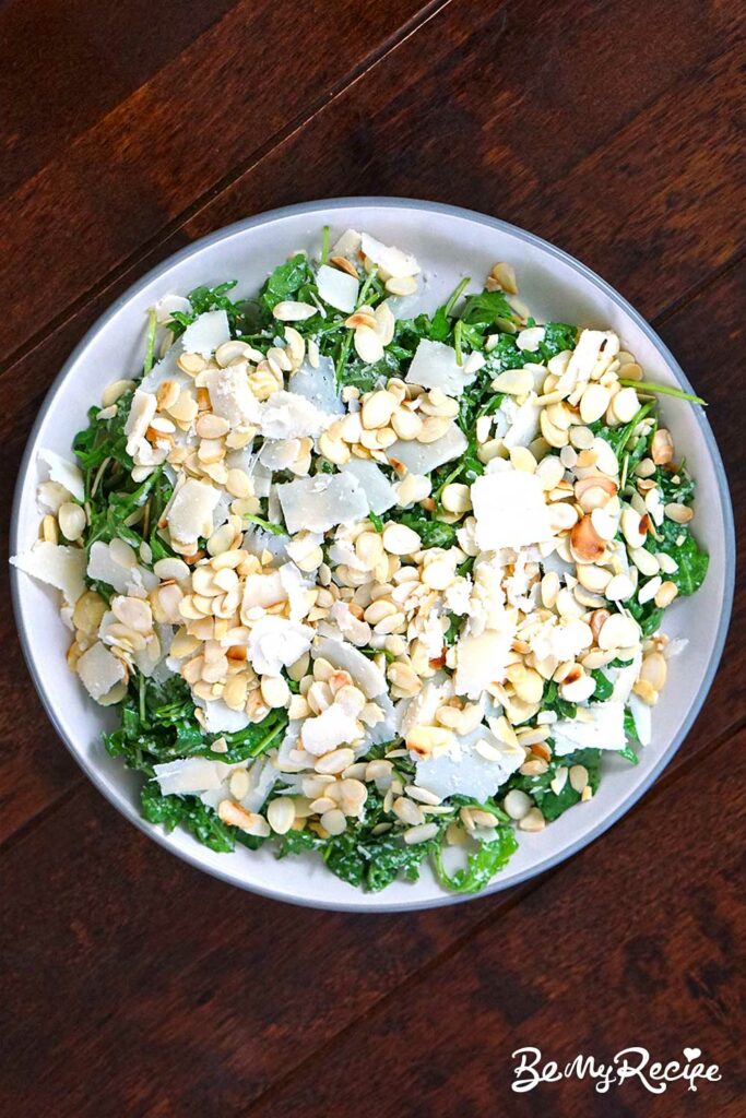 arugula parmesan salad with flaked almonds on top