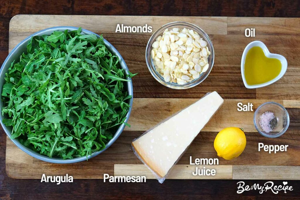 Arugula parmesan salad ingredients on a board