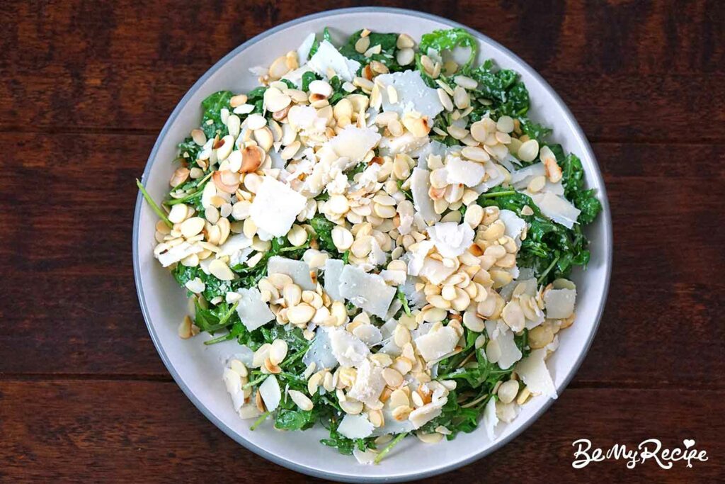 Arugula parmesan salad with flaked almonds on top