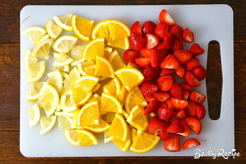 Chopped strawberries, oranges, and lemons.