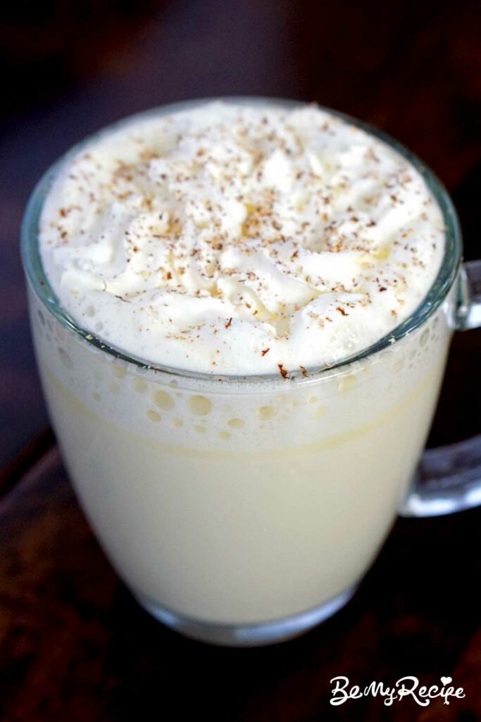 white hot chocolate with whipped cream and nutmeg