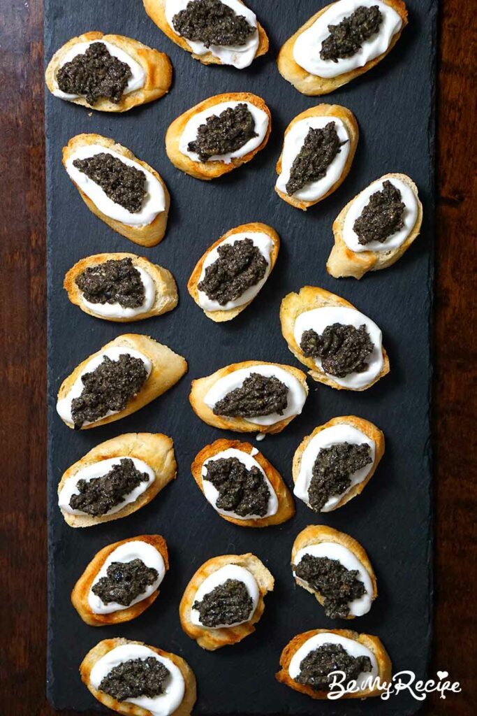 Crostini with whipped ricotta and tapenade