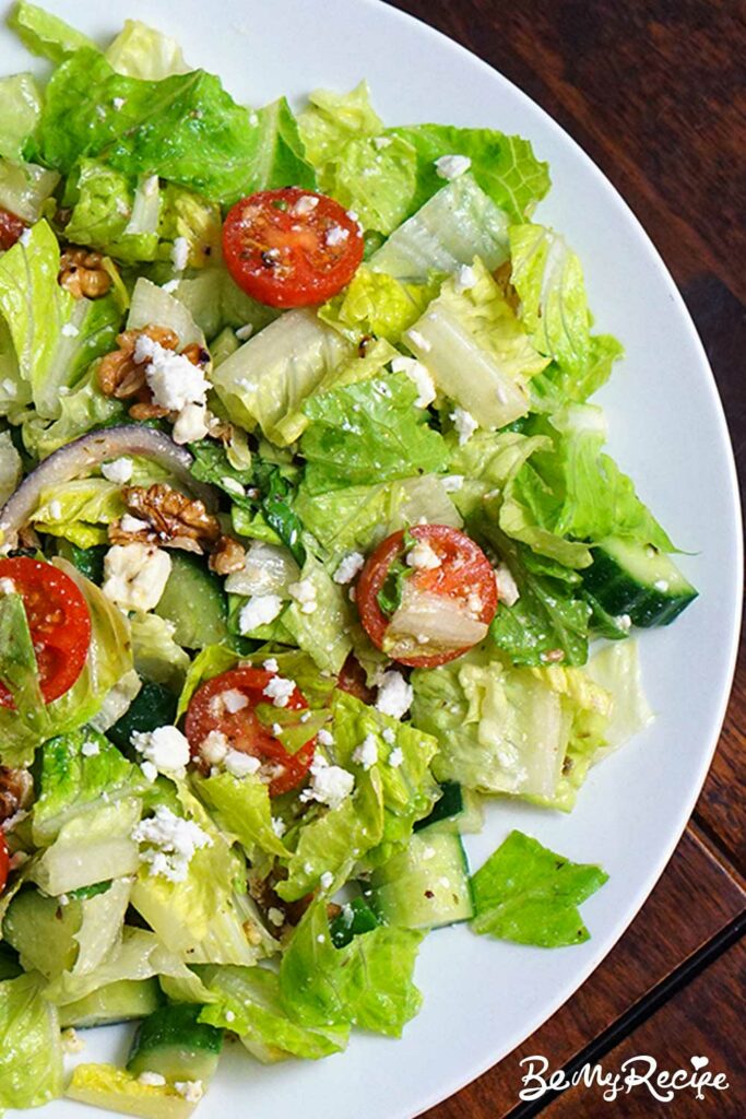 Romaine salad with feta, walnuts, cucumber, and tomatoes