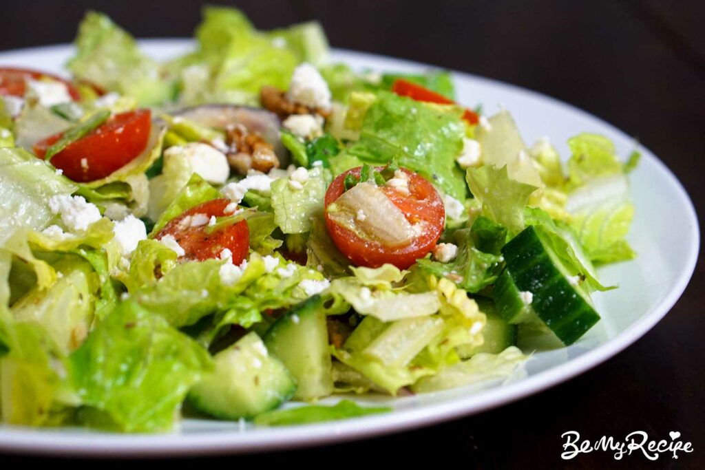 Romaine salad with feta, walnuts, cucumber, and tomatoes 
