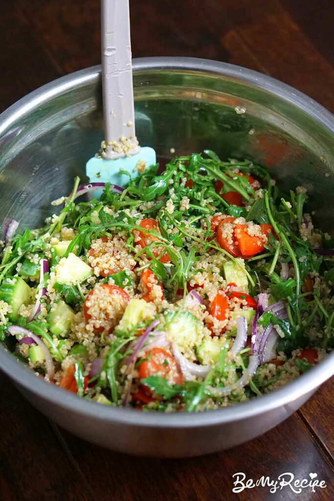 Tossing the quinoa salad (minus the avocado and goat cheese)