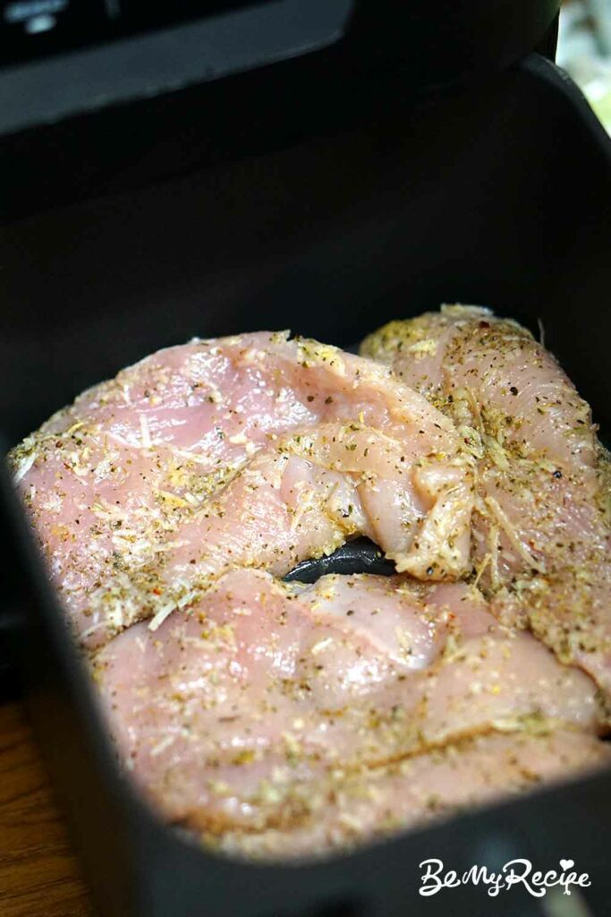 Seasoned chicken breasts in the air fryer