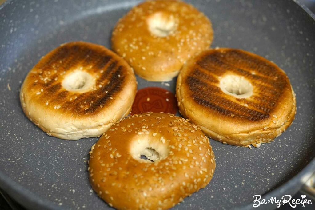 Toasting the bagels in the pan