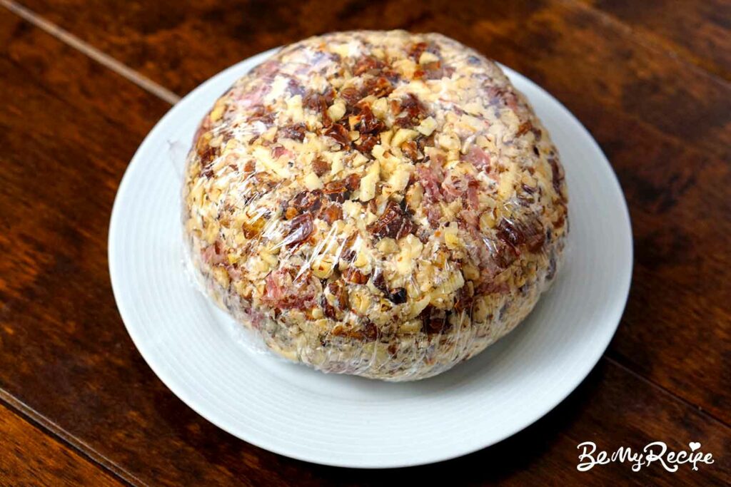 Wrapped up cream cheese ball to be refrigerated