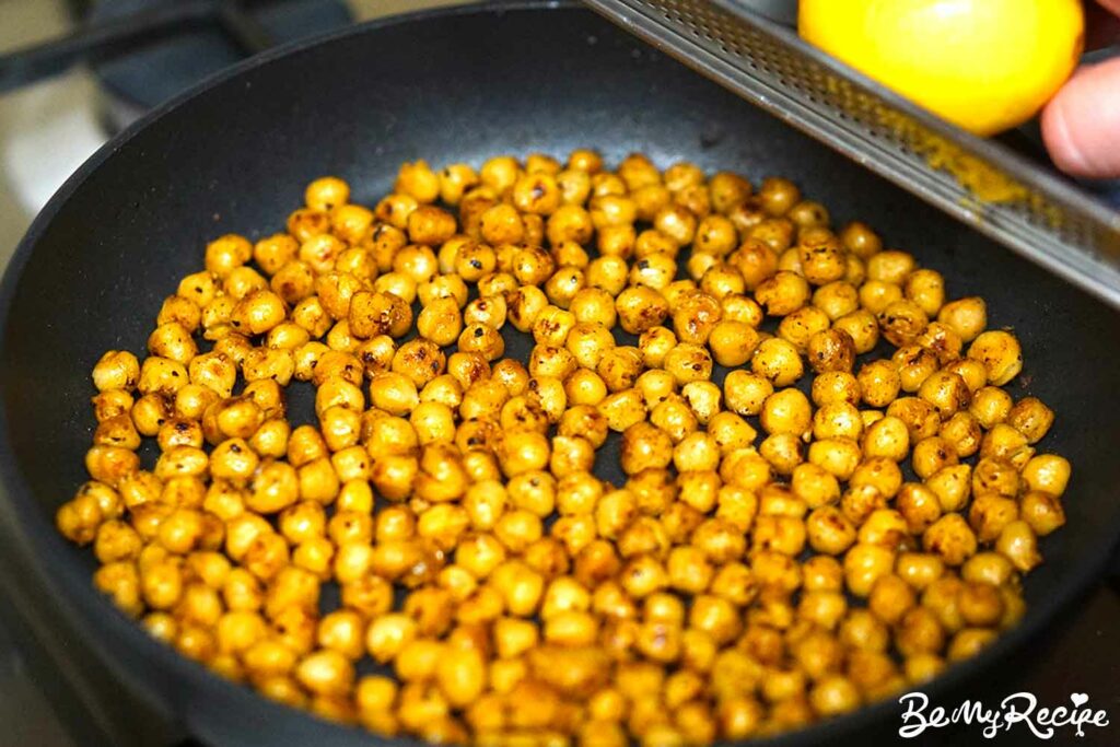 Adding lemon juice and zest to the chickpeas