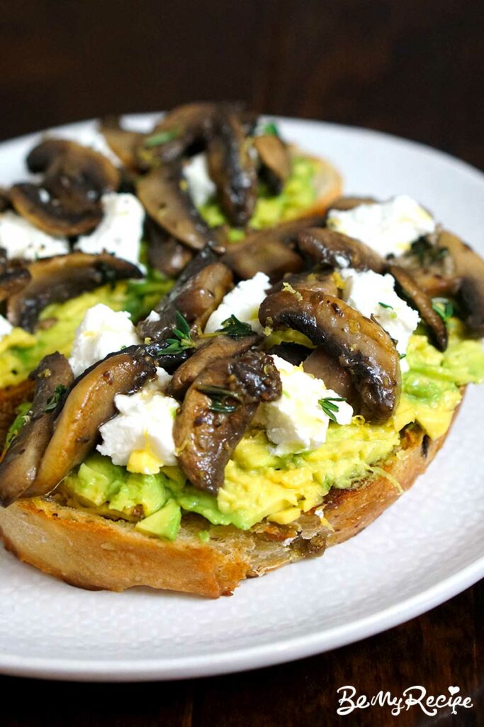 Avocado Toast with Mushrooms and Goat Cheese with fresh thyme and lemon