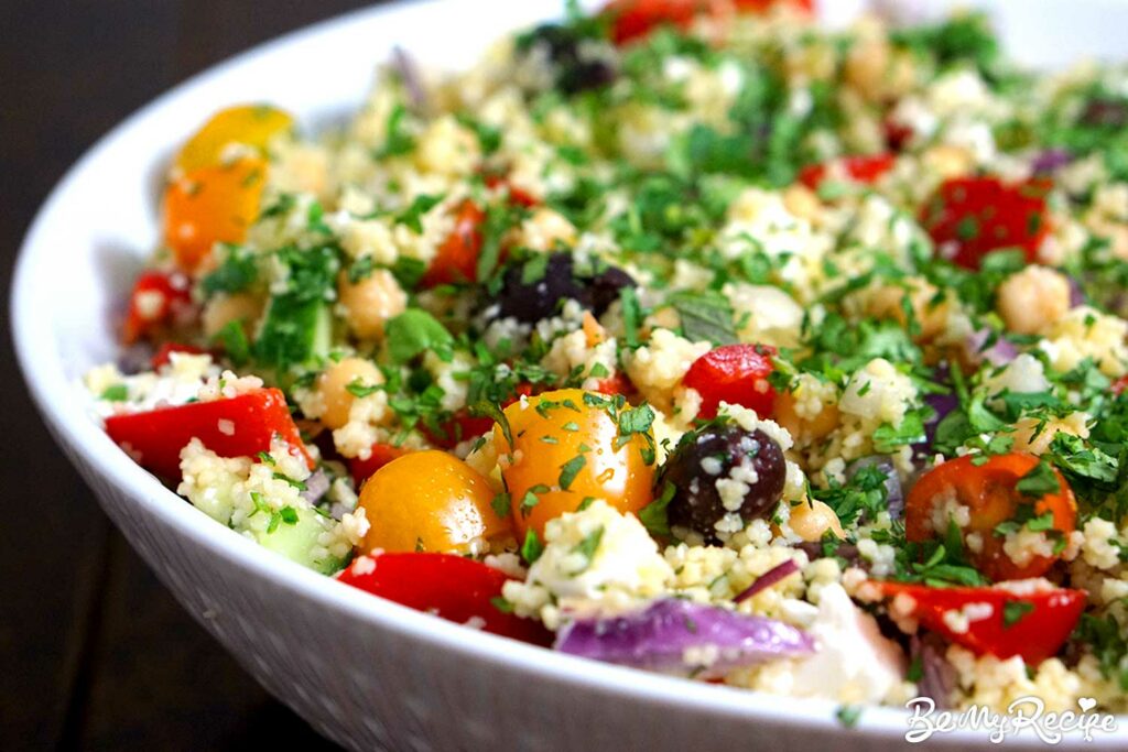 Couscous Salad with garbanzo beans, fresh veggies, lemon vinaigrette, olives, and fresh herbs