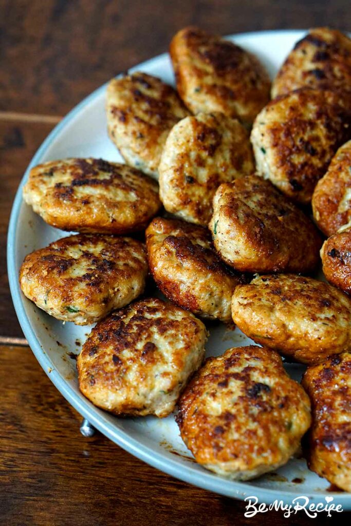 chicken meatballs/patties (kotleti-shaped) on a large plate