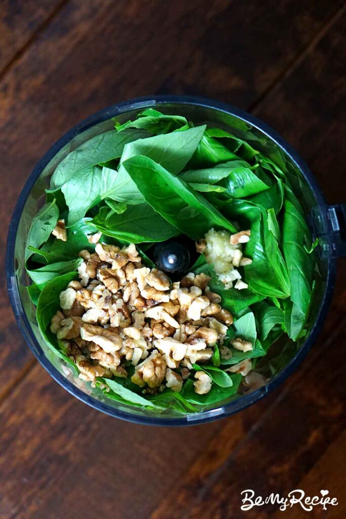 Ingredients for the walnut pesto in a food processor